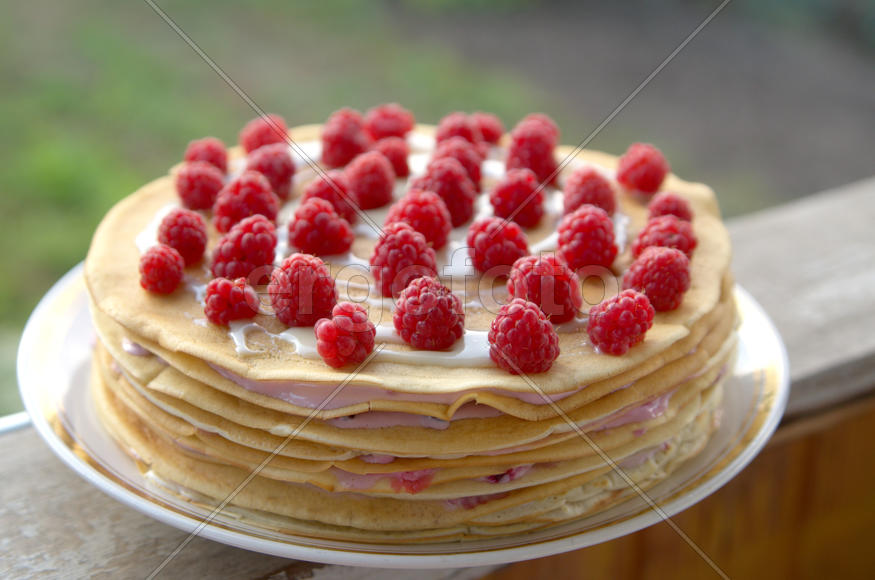 Pancake cake with raspberries and butter cream