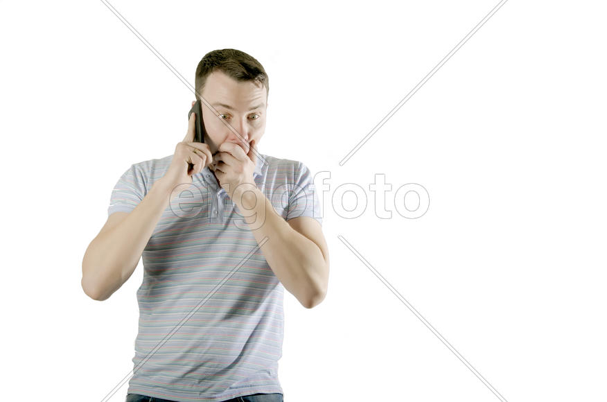 Frightened man talking on the phone isolated on a white background