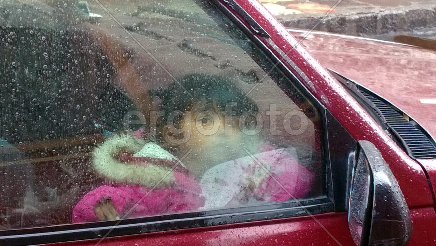 Mexican girl in a car window