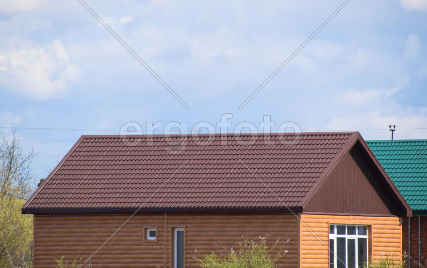 The roof of corrugated sheet on the houses. 