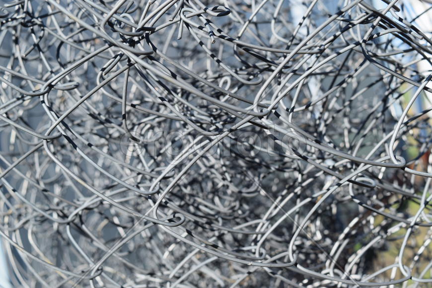 Background of folded mesh netting. Grey mesh netting