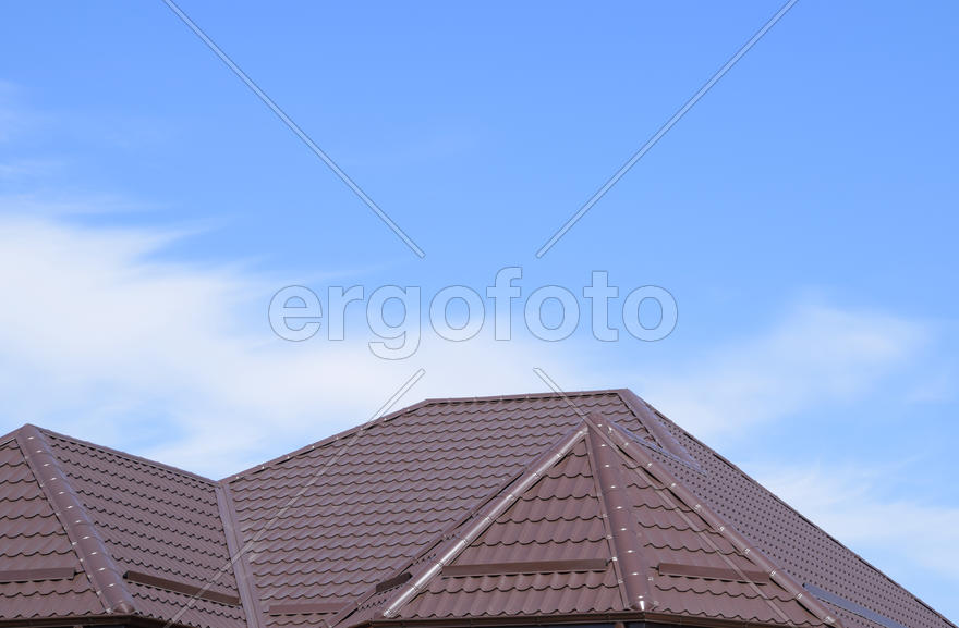 The roof of corrugated sheet. Roofing of metal profile wavy shape.