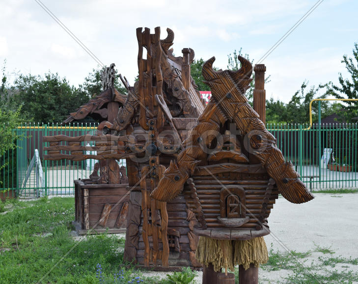 Wooden cottage Baba Yaga. Fabulous street scenery