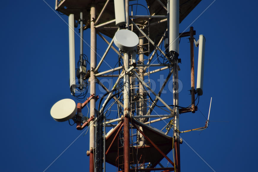 Satellite antennas and repeaters on the tower. Telecommunications