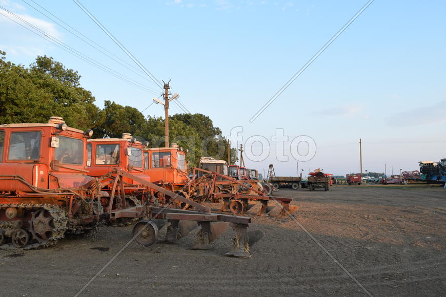 Russia, Temryuk - 15 July 2015: Tractor, standing in a row. Agricultural machinery. Parking of agric