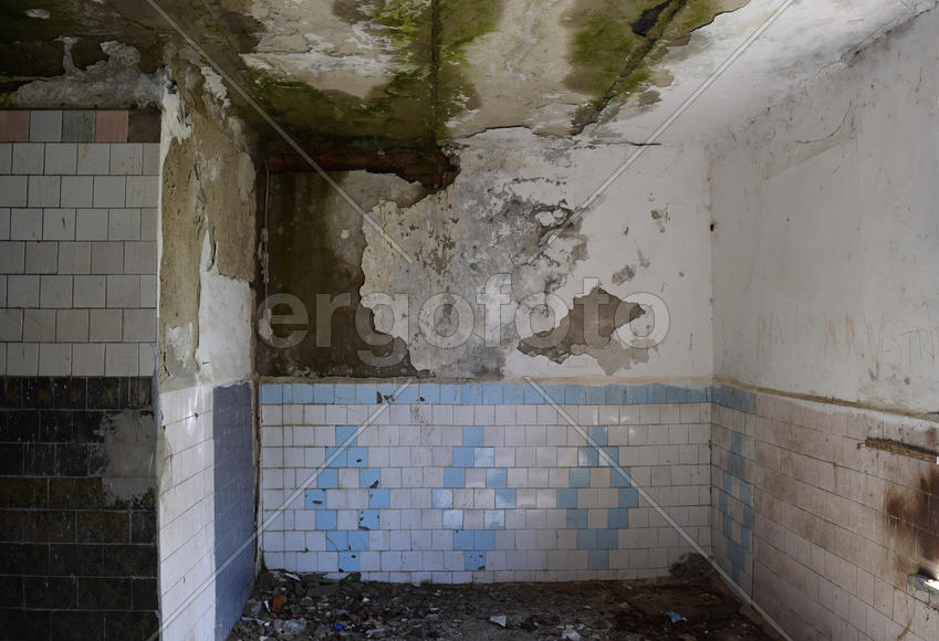 The walls of an old abandoned building. The ruins of the buildings of the twentieth century