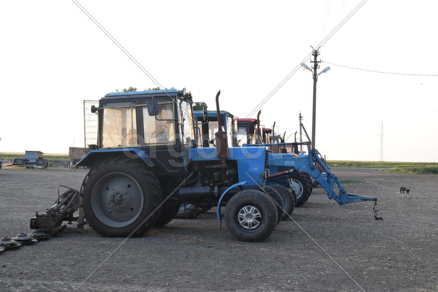 Russia, Temryuk - 15 July 2015: Tractor, standing in a row. Agricultural machinery. Parking of agric