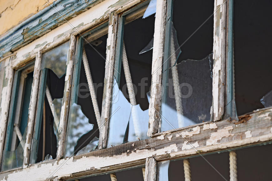 Windows with the broken glasses. The old thrown gas station