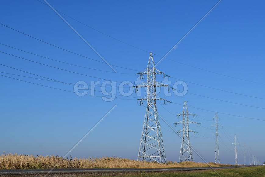 Support of electricity cables along the road. Country road