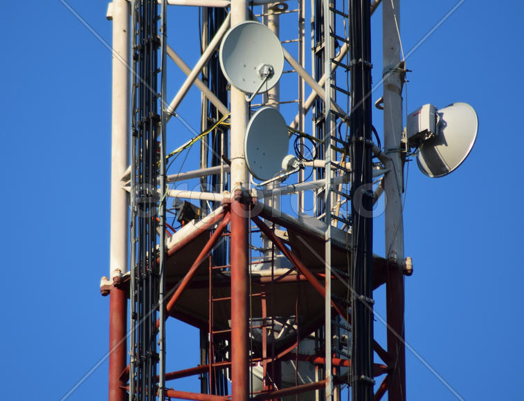 Satellite antennas and repeaters on the tower. Telecommunications