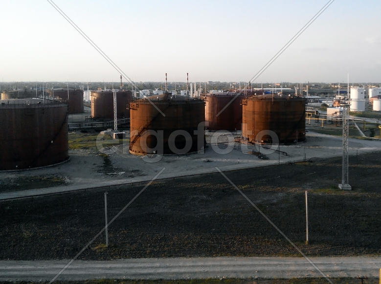 Tank the vertical steel. Oil refinery. Equipment for primary oil refining