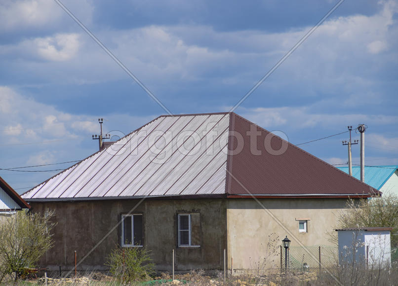 The roof of corrugated sheet on the houses.