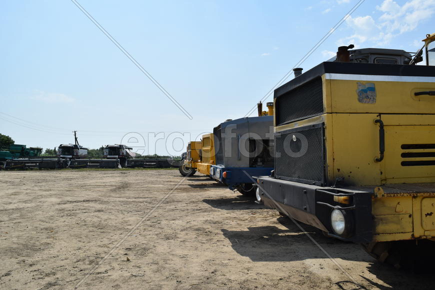 Russia, Temryuk - 15 July 2015: Tractor, standing in a row. Agricultural machinery. Parking of agric