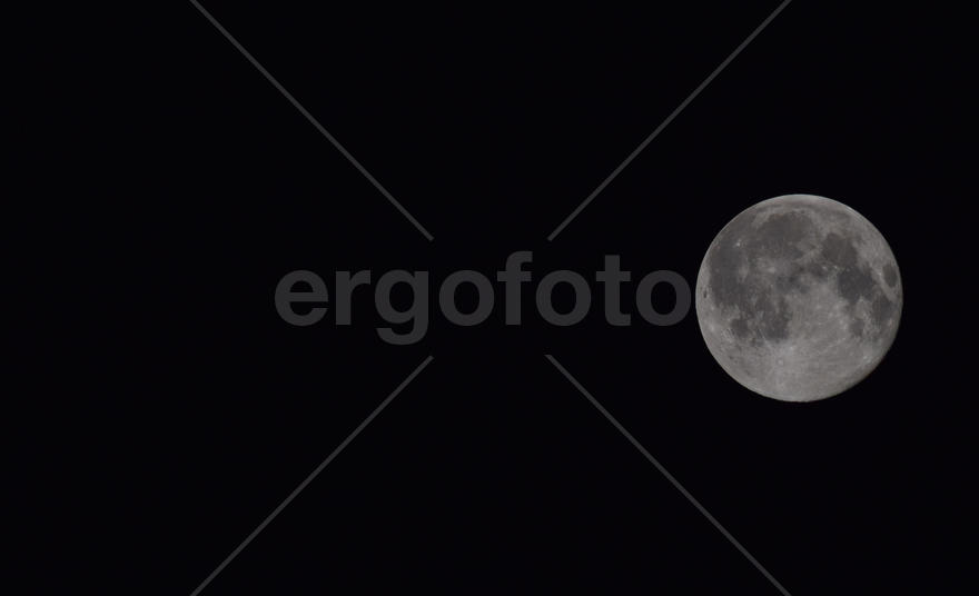 The moon in the night sky. Two thirds of the moon