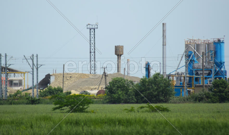 Cement works. heaps of a galechnik and industrial constructions
