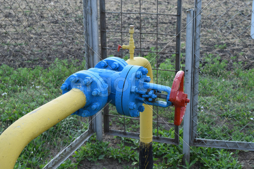 The latch on the underground gas pipeline protected with a fence