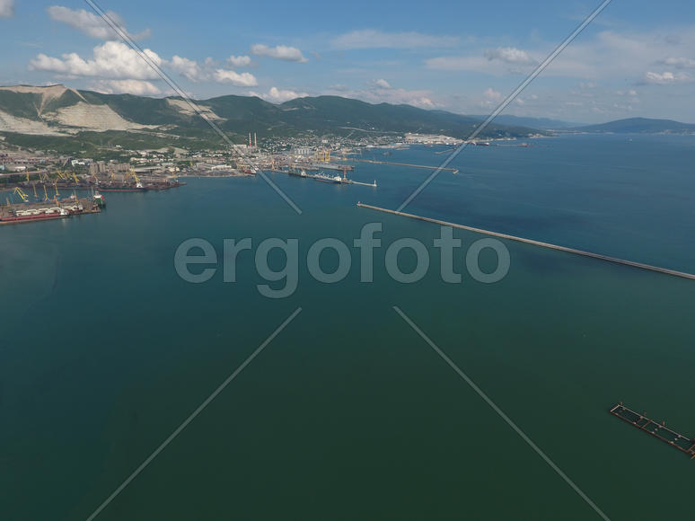 Top view of the bay Tsemess. The international sea port of Novorossiysk. Mol - building to stop the 