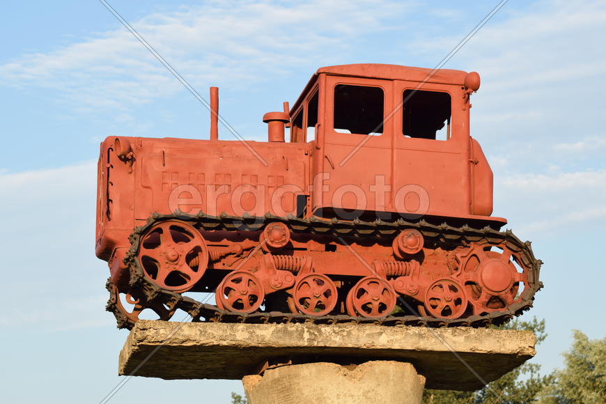 Russia, Temryuk - 15 July 2015: Tractor on a pedestal. Monument agricultural machinery.
