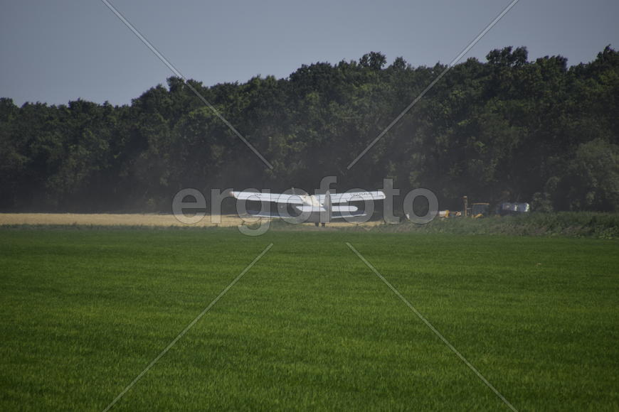 Aircraft agricultural aviation AN-2. The spraying of fertilizers and pesticides on the field with th