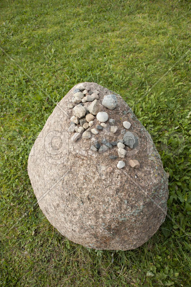 Big stone on the grass