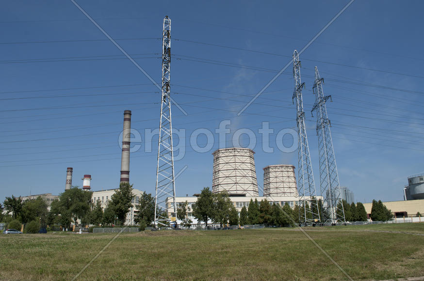 Thermal power plant on the outskirts of the city on a sunny day
