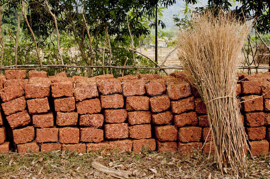 Brick built along the fence in the Indian village