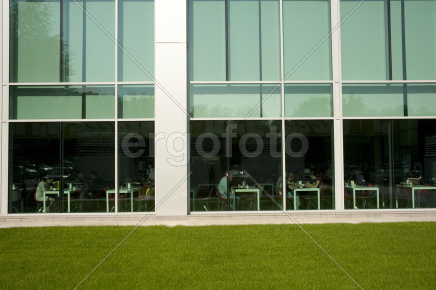 Window and a reflection on the facade of an office building