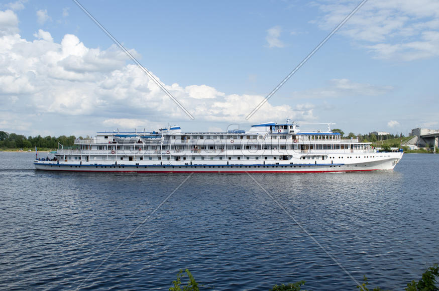 White boat sailing on the Volga in the sun