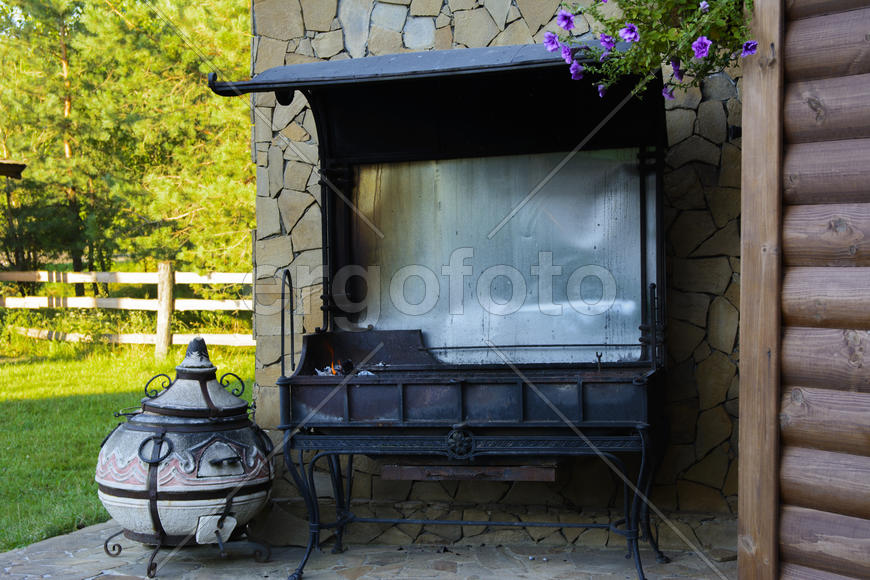 Barbecue near the wall of a private house