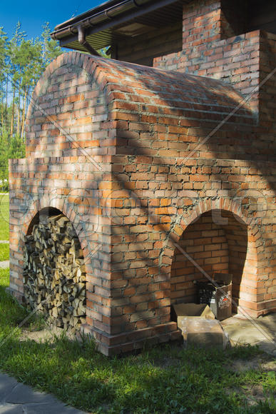 Firewood stacked near the stove near a private house