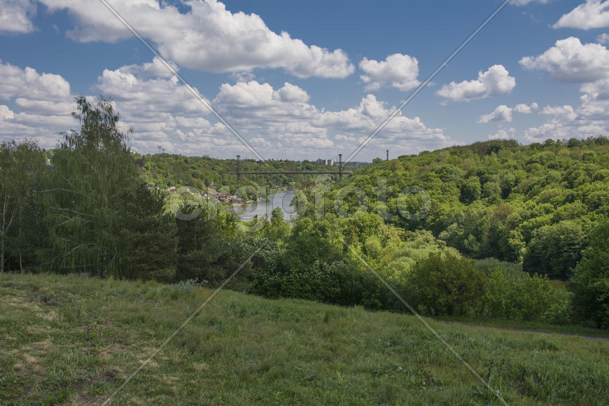 Suspension bridge across the river in city park