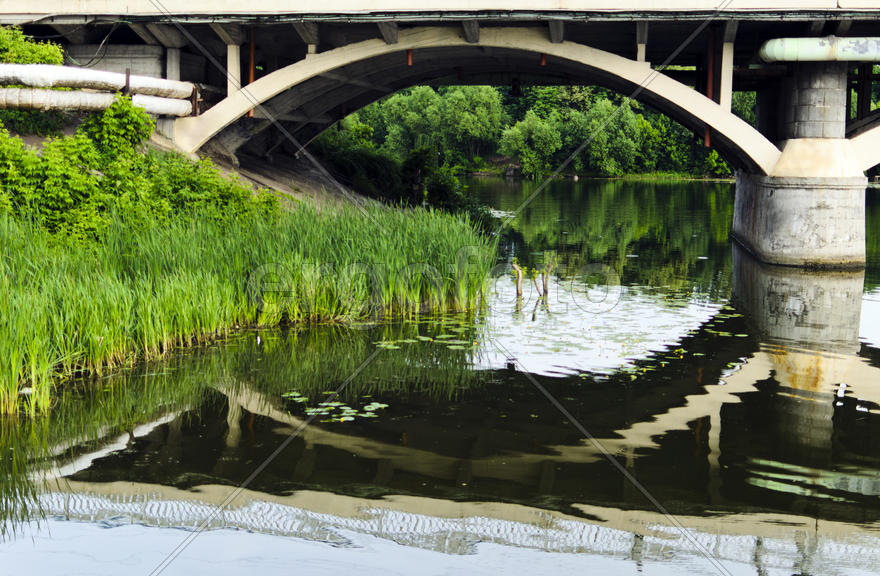 Bridge reflection through the river the Southern Bug