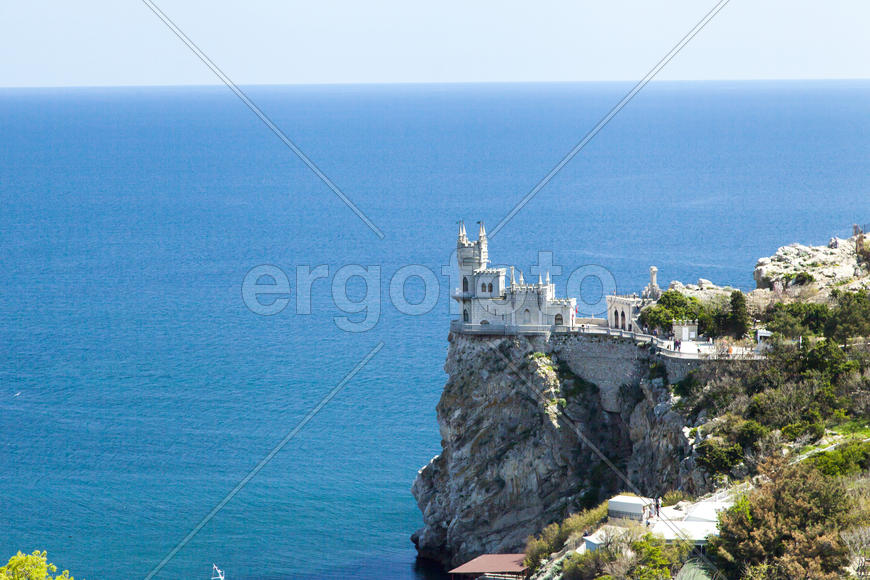 The castle by the sea is on the rock highly above water