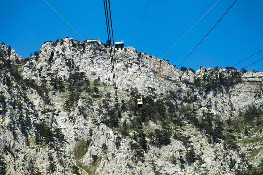 Ropeway on the high mountain in the sunny day