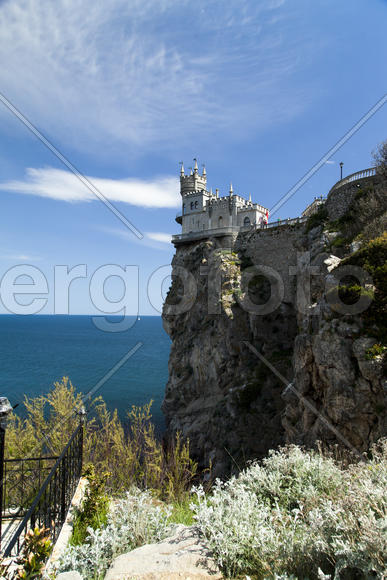 The castle by the sea is on the rock highly above water