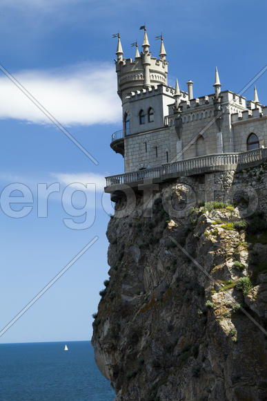 The castle by the sea is on the rock highly above water