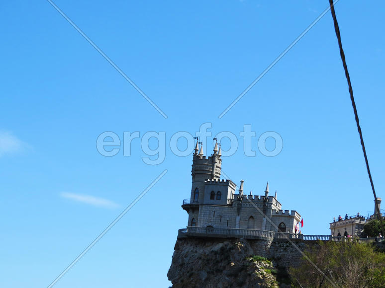 The ancient castle is on the high rock above the sea                               