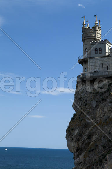 The castle by the sea is on the rock highly above water