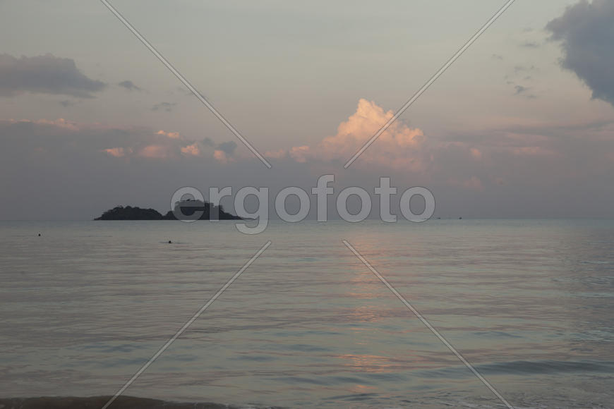 The seashore at sunrise absolutely silent waiting for the sun and people