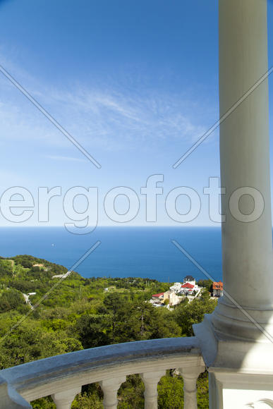 Arbor with columns overlooking mountains and the sea