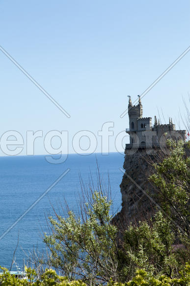 The castle by the sea is on the rock highly above water