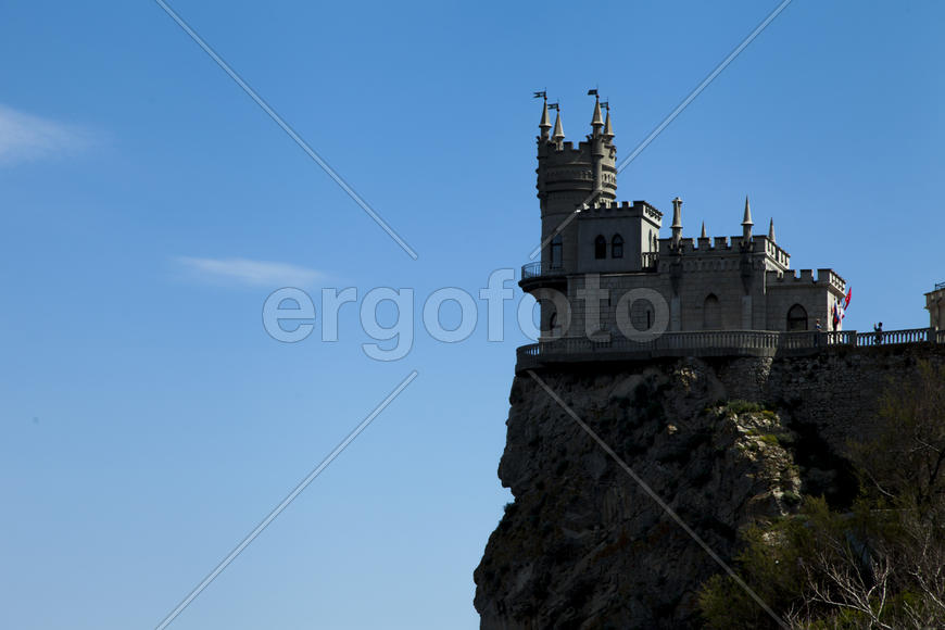 The castle by the sea is on the rock highly above water