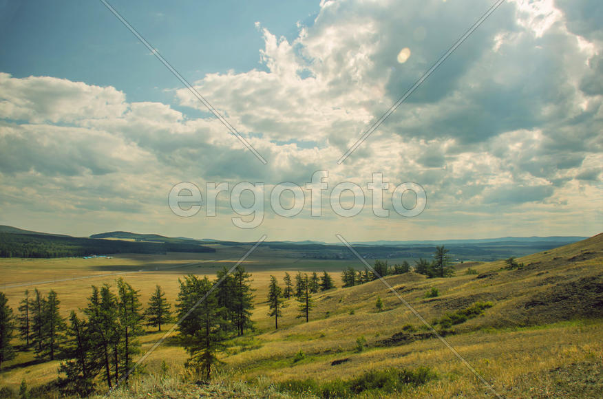 mountain landscape with clouds of rays is