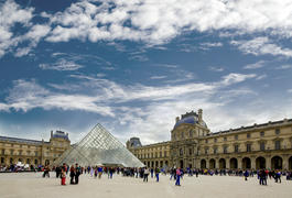 Crowded area near the Louvre glass pyramid in the courtyard of Napoleon in ParisCrowded area near th