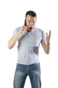 Аngry man shouting talking on a mobile phone on a white background