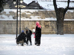 Children making a snowman in Istanbul