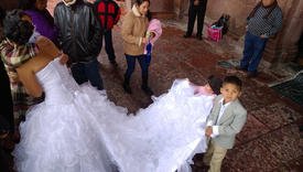 Mexican children with a bridal veil