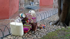 Traditional Mexican bags lying on the ground