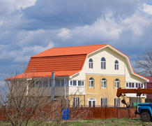 The roof of corrugated sheet on the houses. 