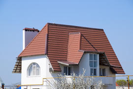 The roof of corrugated sheet on the houses.
